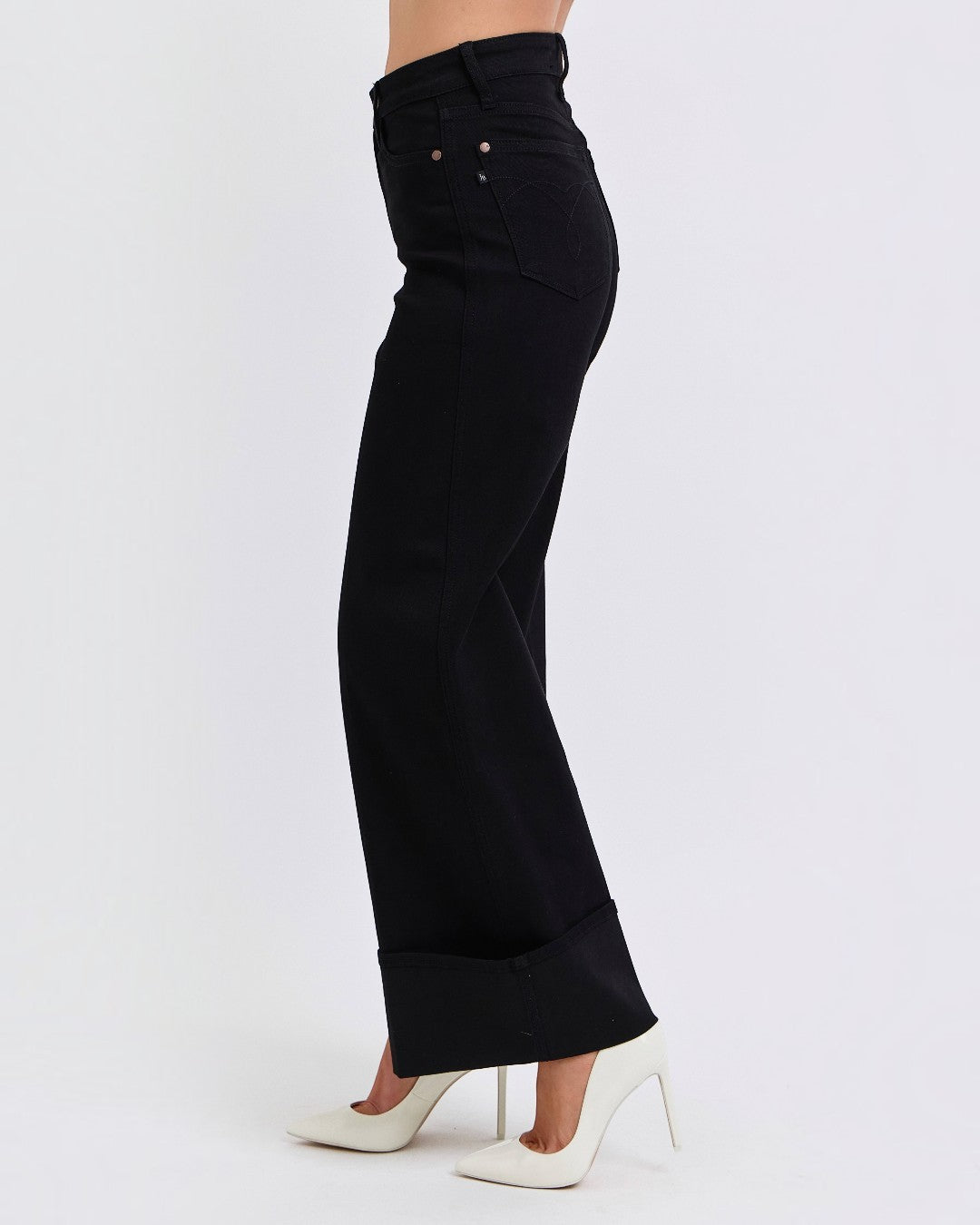 Black wide-leg pants worn by a person on a white background