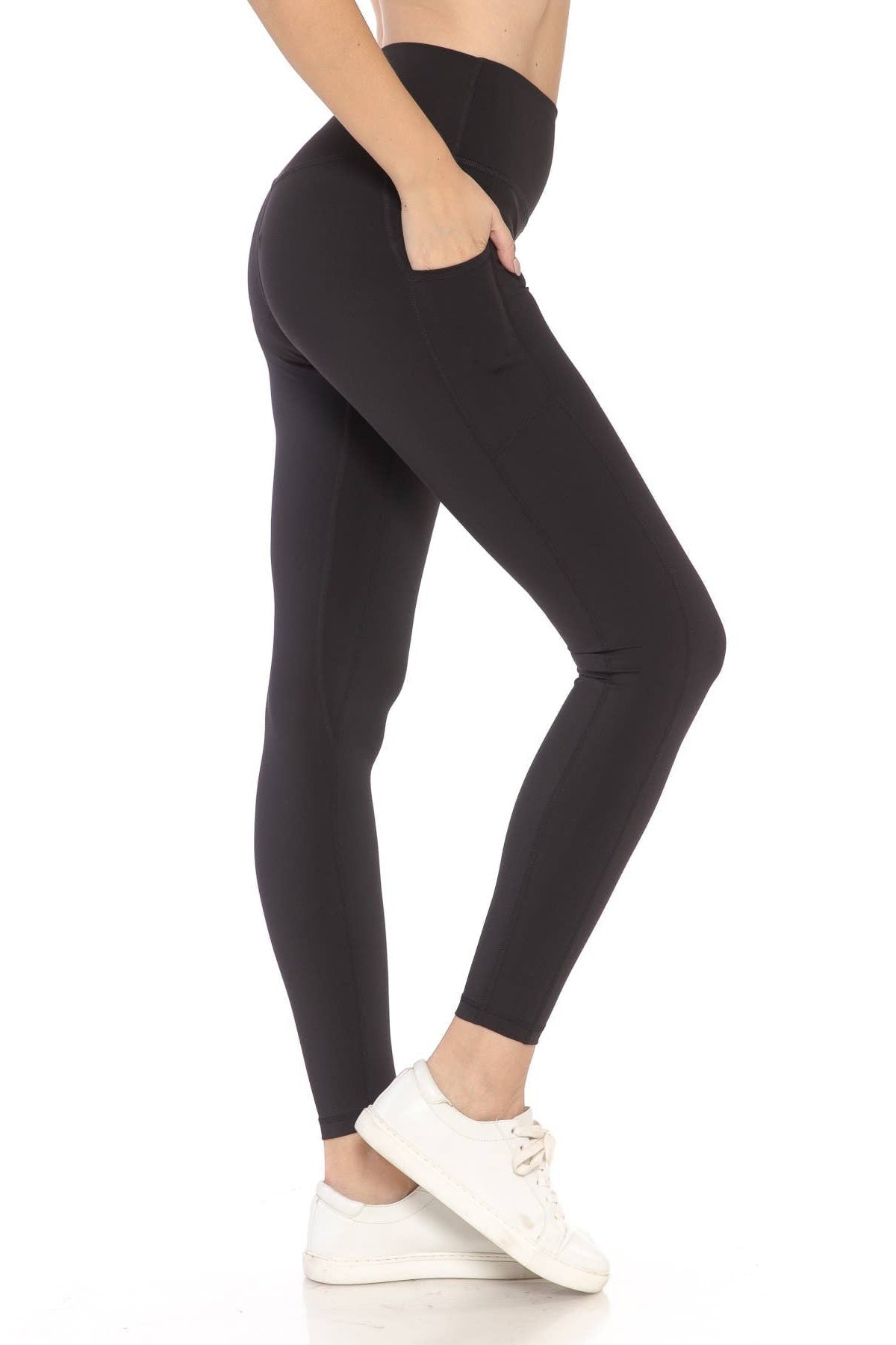 Person wearing black leggings on a white background