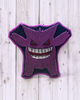 Calla Lily Cosmetics + CL kids Gengar shaped grape scented bath bomb with hand-painted purple and black mica details.