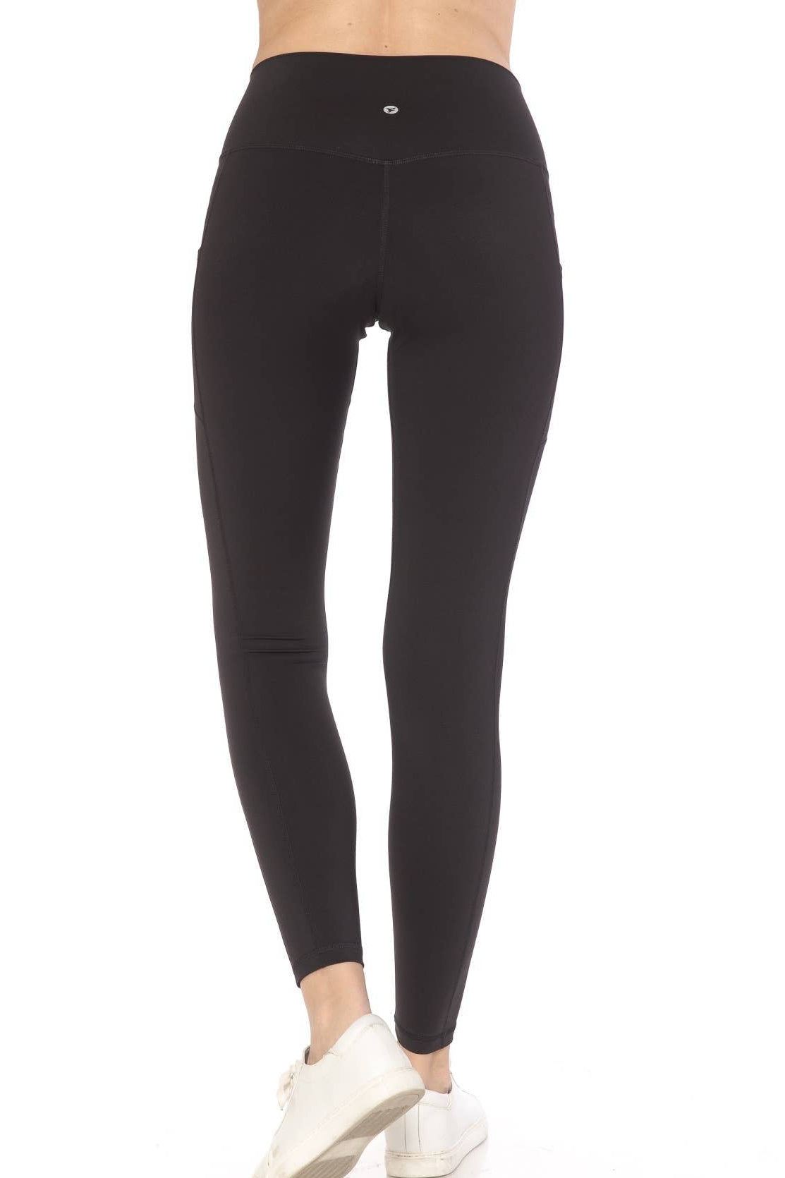 Black leggings worn by a person on a white background