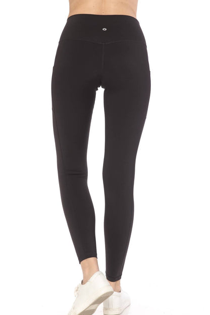 Black leggings worn by a person on a white background