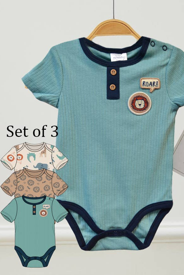 Set of three baby rompers with short sleeves on a white background