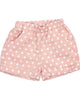 Pink shorts with white polka dots on a white background