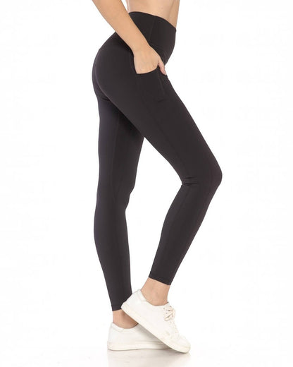 Person wearing black leggings on a white background