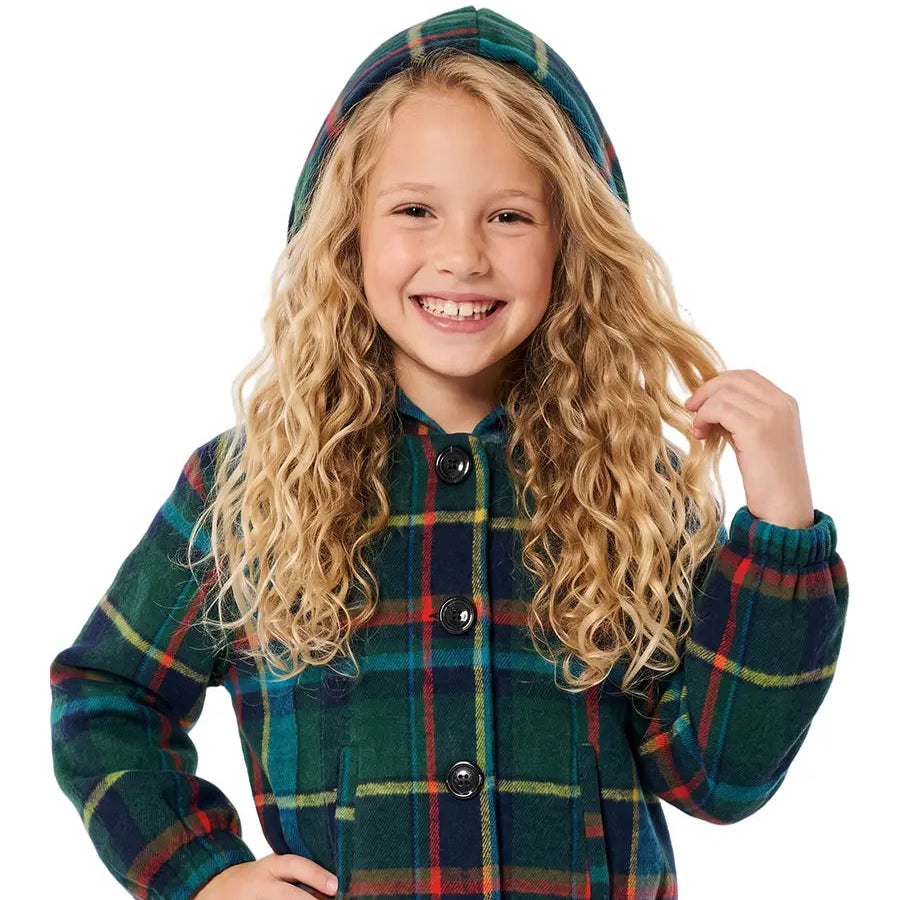 A young girl with long, curly blonde hair wearing a green plaid hooded jacket with red and yellow stripes, paired with blue jeans, photographed against a solid white background.