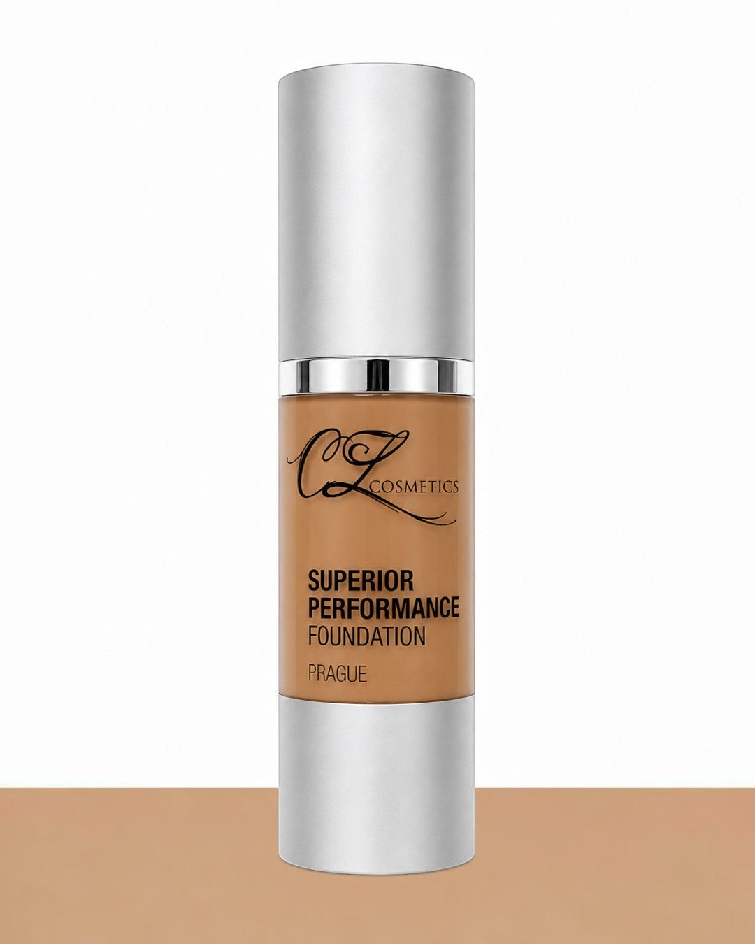 Foundation bottle with silver cap and brown body on a white background