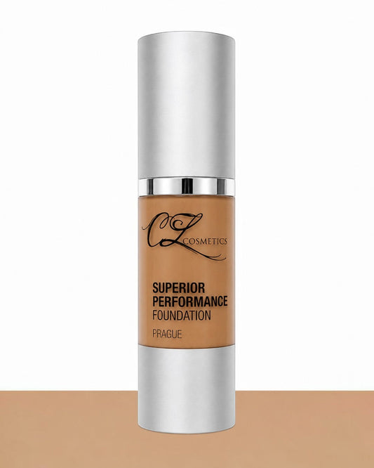 Foundation bottle with silver cap and brown body on a white background