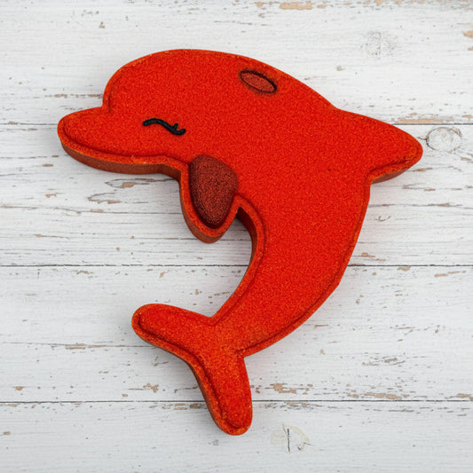 Red dolphin-shaped toy on a white background