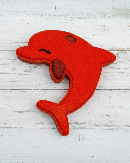 Red dolphin-shaped toy on a white background