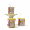 votive candle sugared lemon on a white cake stand
