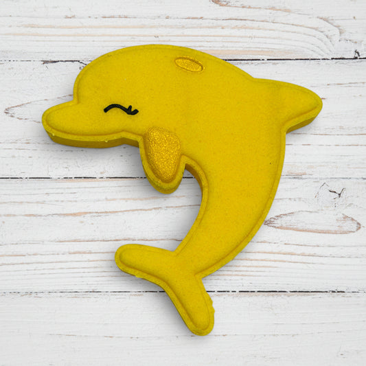 Yellow dolphin-shaped toy on a white background