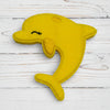 Yellow dolphin-shaped toy on a white background